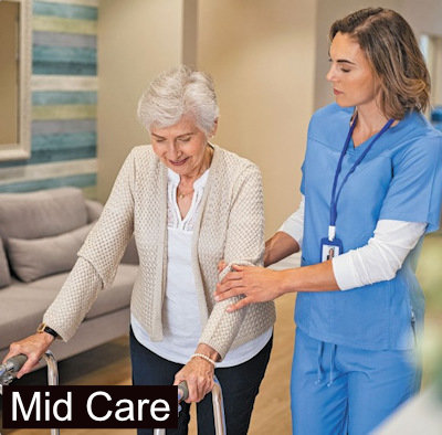 nurses making a frail care resident comfortable