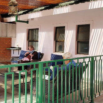 Mid-care patients enjoying activity time on the veranda