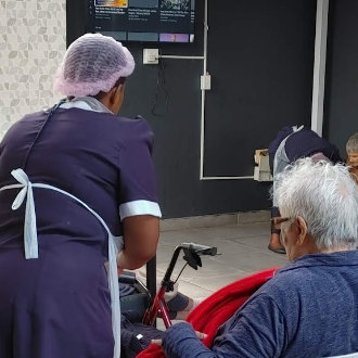 nurse helping a disbled care patient